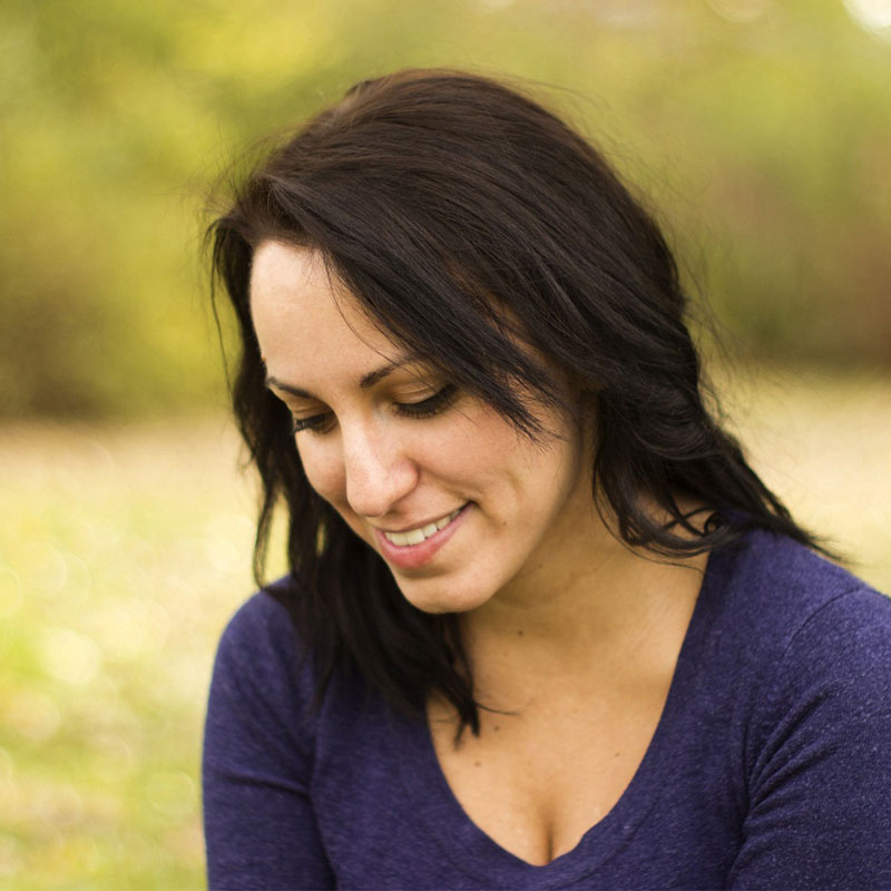 woman smiling to illustrate taking ADK supplement