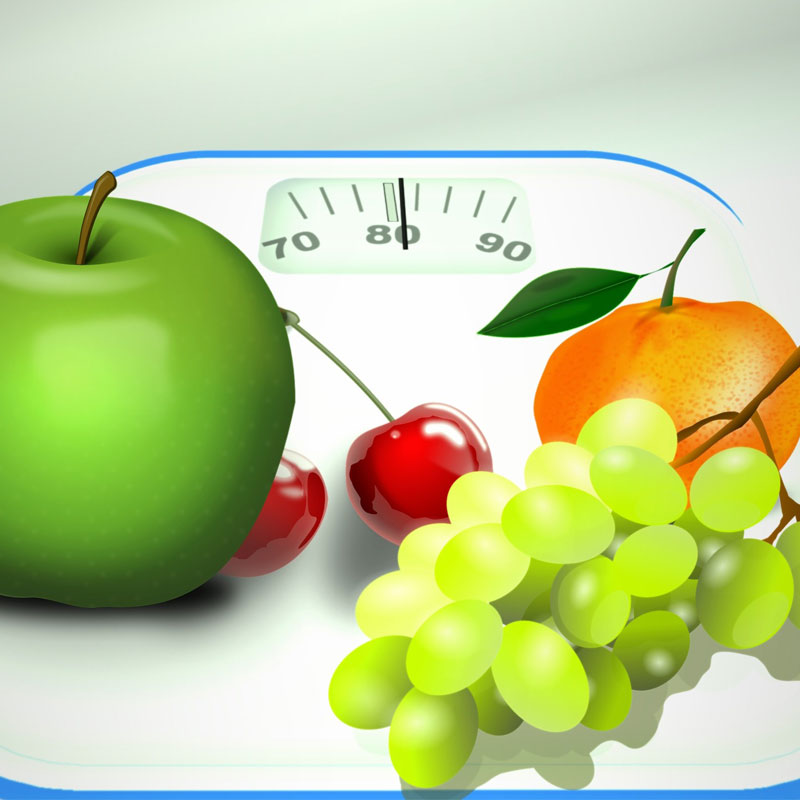 scales, apple, grapes, orange and cherries to illustrate healthy body weight
