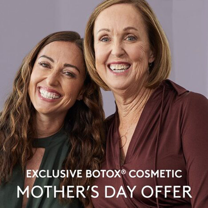 Two smiling ladies to illustrate treatment with Botox in Denver